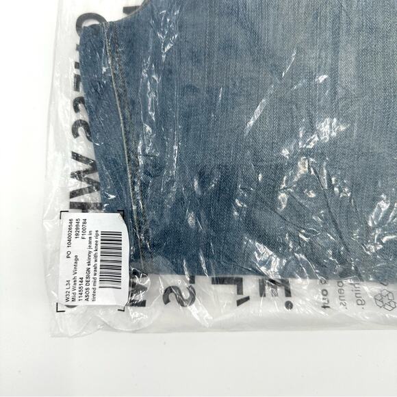 ASOS DESIGN skinny jeans in tinted mid wash with knee rips Size 32x34 - Picture 7 of 8